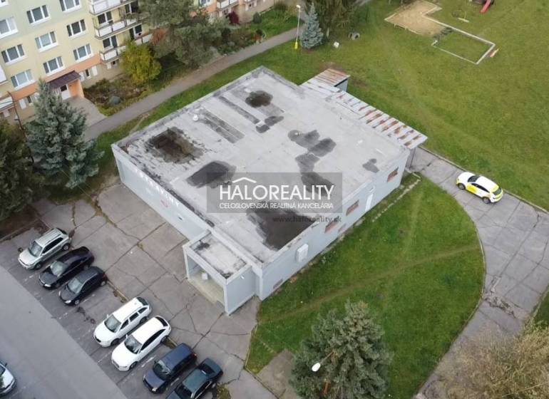 In Rimavská Sobota, the commercial spaces are surrounded by apartment buildings and parking spaces.