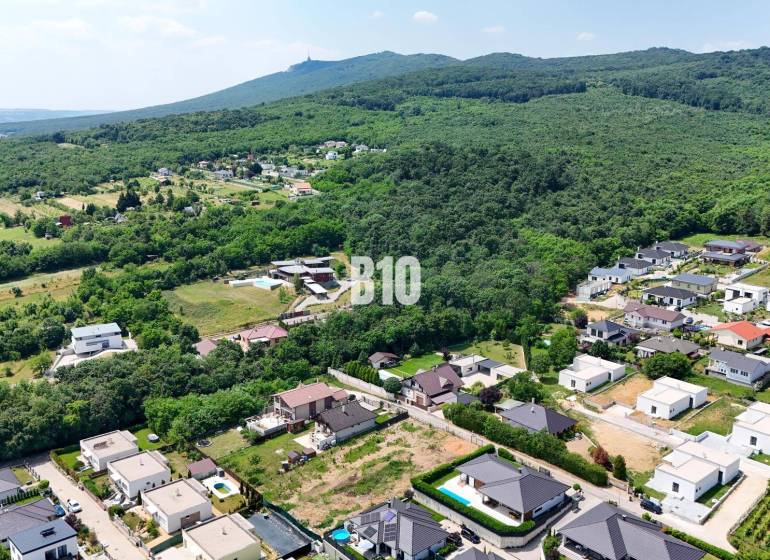 Aerial panorama of development on the edge of the forest in Štitáre, Land - housing.