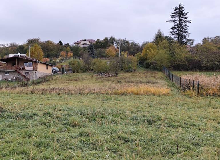 Exterior in the area of Velký Bab, suitable for residential plots, with houses and nature.