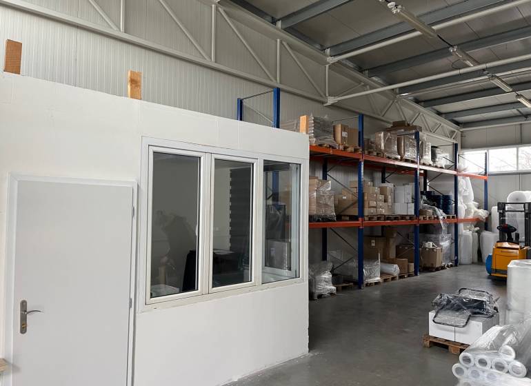 Warehouses and halls with shelves, goods, and a forklift.