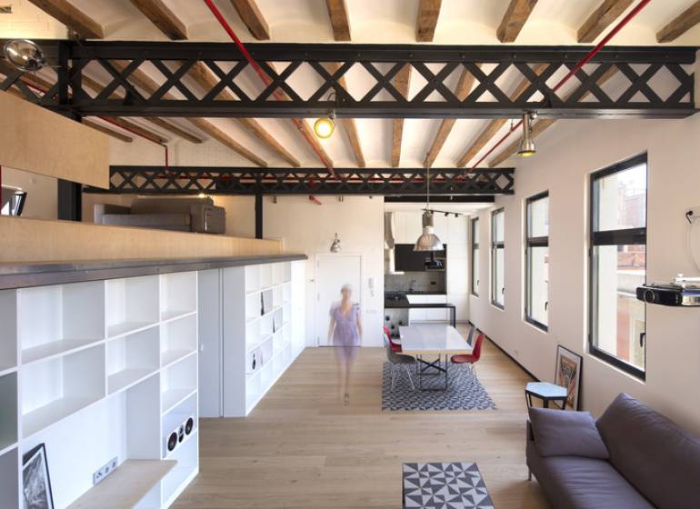 Spacious interior with wood-patterned flooring and open shelving in warehouses and halls.