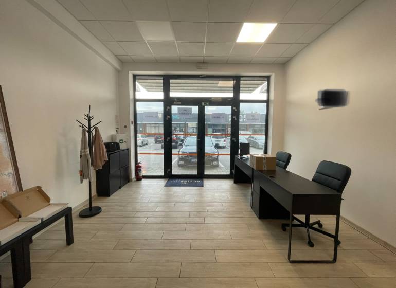 Interior of commercial spaces with furniture and flooring featuring a wood decor.
