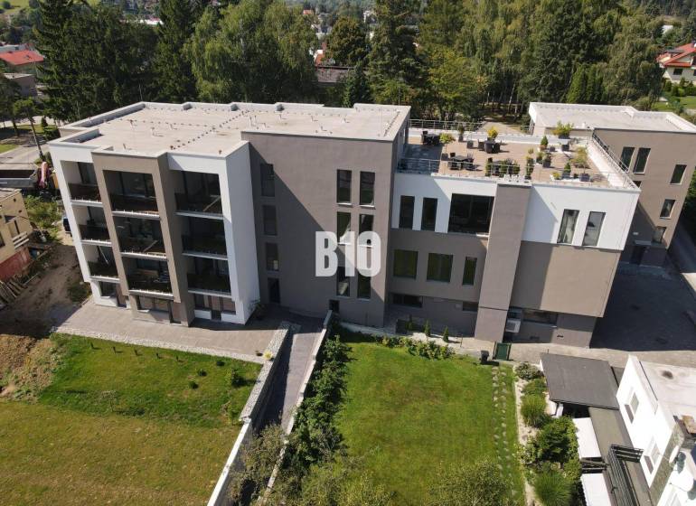 Apartment complex on M. R. Štefánik Street in Rajecké Teplice surrounded by greenery.
