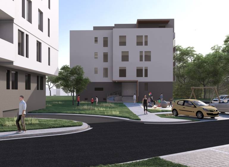 Building in Galanta, surroundings with people, cars, and a playground, offering a 2-room apartment.