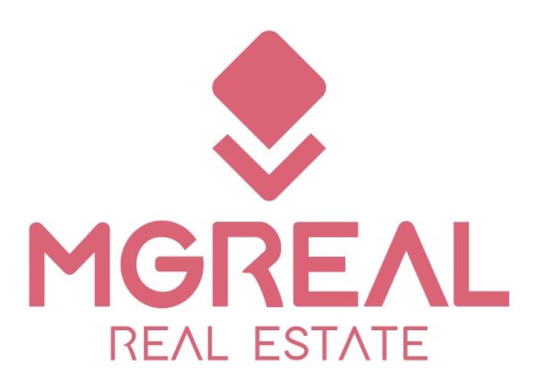 Logo with the inscription MGREAL REAL ESTATE in a shade of pink.