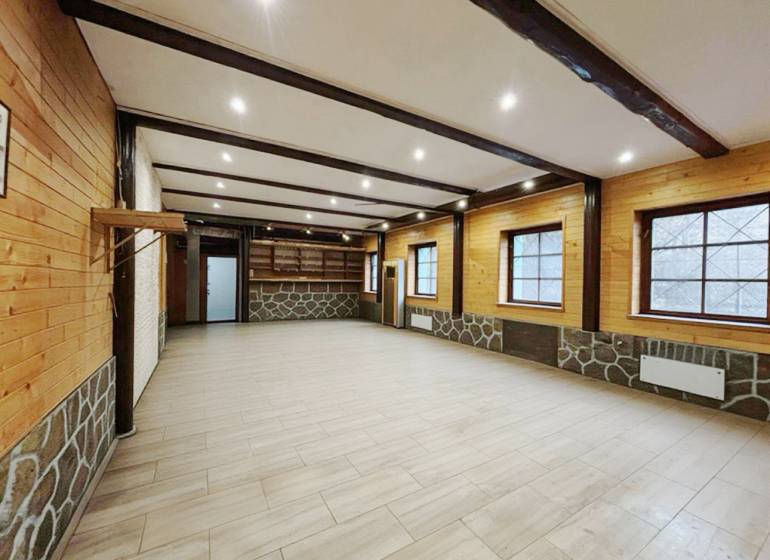 Interior of a family house with a wooden decor floor and wooden walls.