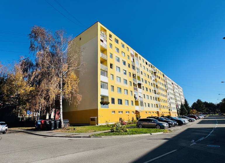 The yellow apartment building on I. Krasko Street in Prievidza, designated for 4-room apartments.