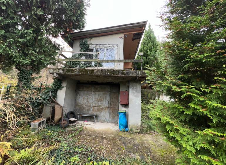 A cottage on Pod Srdcom Street in Bratislava - Devínska Nová Ves surrounded by greenery.