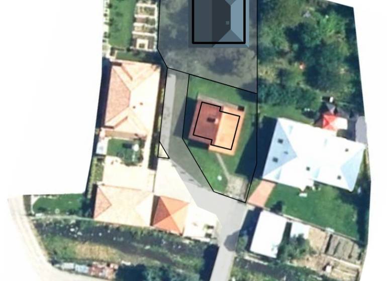 Aerial view of residential plots in the village of Dlhé Pole with surrounding development.