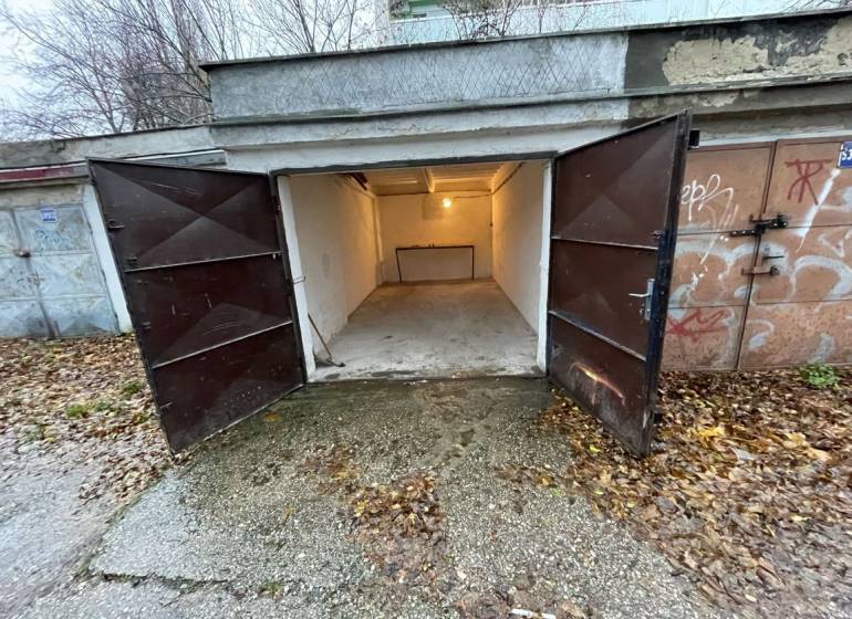 Open garages on Priekopy Street in Bratislava - Ružinov, surrounded by autumn leaves.