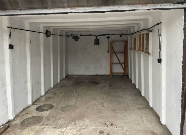 A look into the garage on Prístavná Street in Bratislava - Ružinov with shelves and lighting.