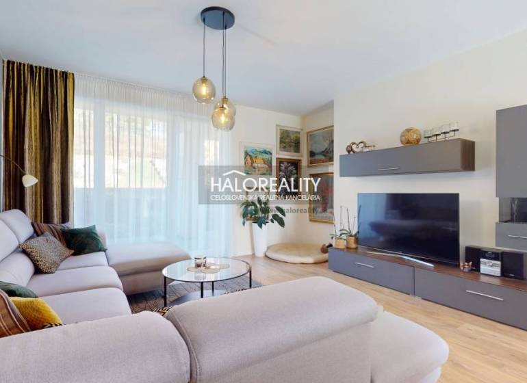 Living room in a family house with a comfortable sofa and a wooden decor floor.