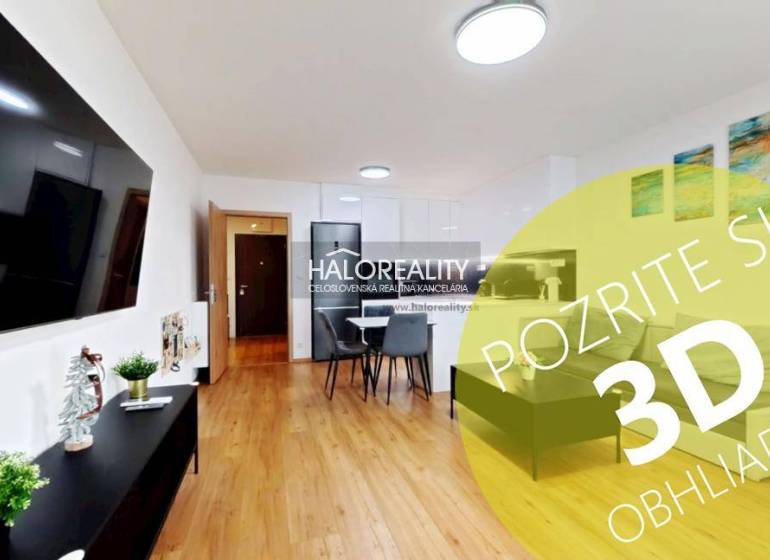 Living room in a two-room apartment with a wooden decor floor, dining area, and a TV on the wall.