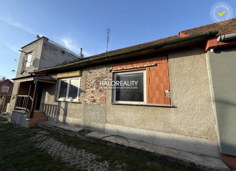 A family house in Chynorany with an unfinished facade, covered with a classic tile roof.