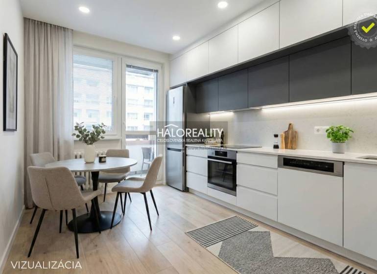 Dining area with a round table and a kitchen with a unit in a 3-room apartment.