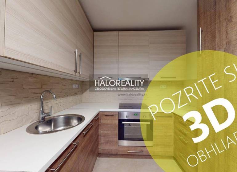 A kitchen in a 2-room apartment with a wooden decor floor and built-in cabinets.