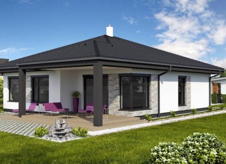 A family house in Most pri Bratislave with a terrace, lawn, and outdoor seating.