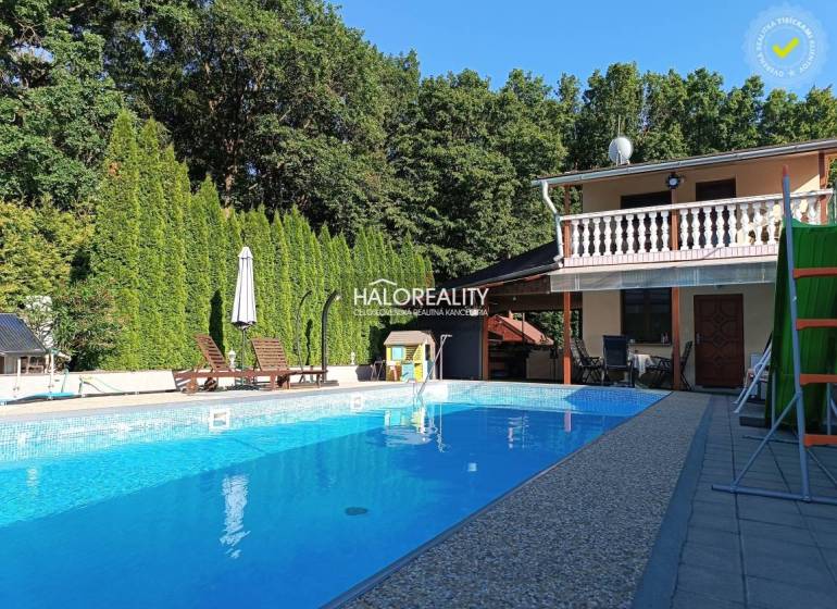 Cottage in Byšta with a pool, terrace, trees, and garden furniture for relaxation.