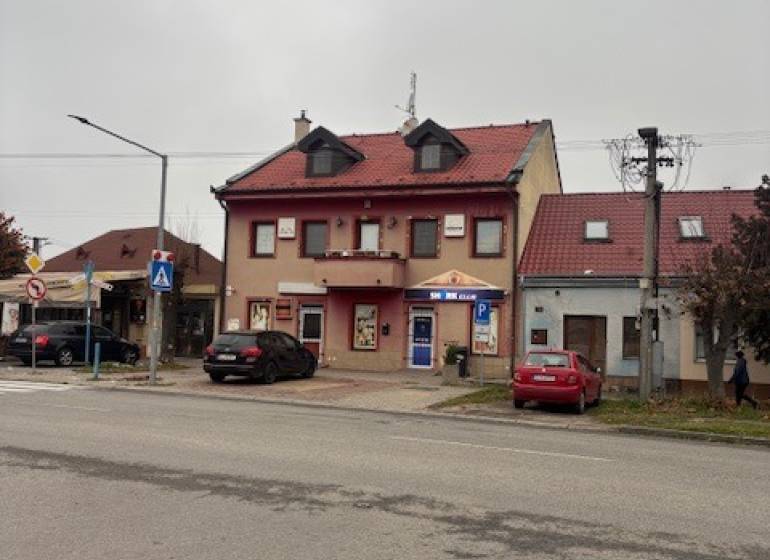 A building with a red roof and shops on Šafárikova Street, Senec, suitable for offices.
