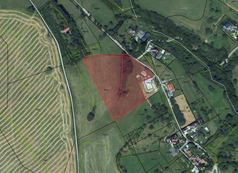 Aerial map of agricultural and forest lands around Banská Štiavnica.