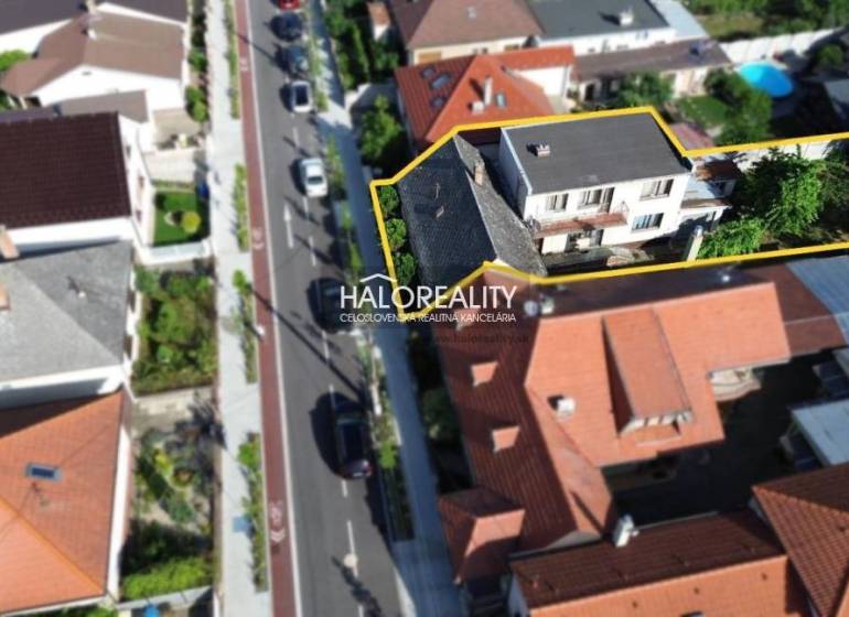 Aerial view of a family house in Malacky with surrounding gardens.