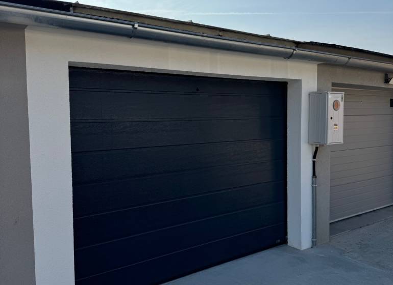 The gate of a modern garage on Slnečná Street in Komárno, equipped with electric control.