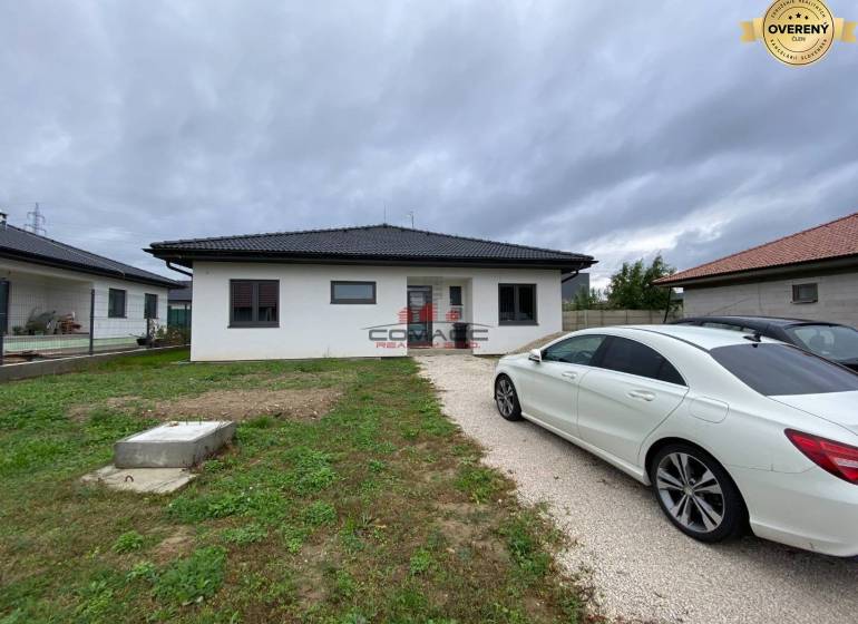 A family house in Nové Mesto nad Váhom, with a car parked in the driveway.