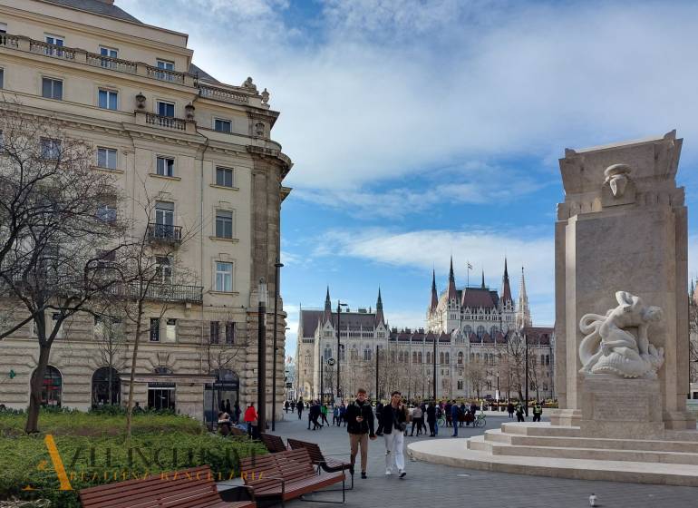 Budapest 5th District, Martyrs' Square depicts a historic building and a monument in an urban setting.