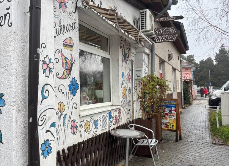 Commercial premises on Moyzesova Street in Senec with outdoor flower drawings and benches.