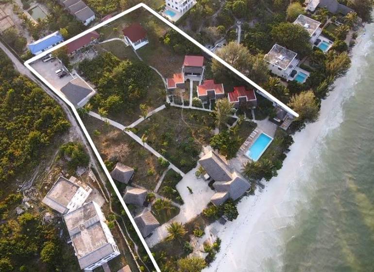 Aerial view of a beach resort in Paje, Zanzibar South East with a pool.