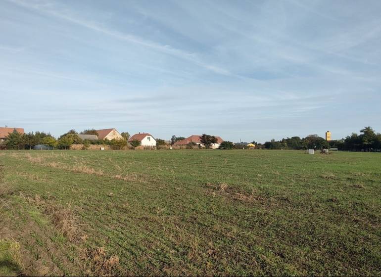 Residential plots in Rastislavice with a view of the village and greenery.