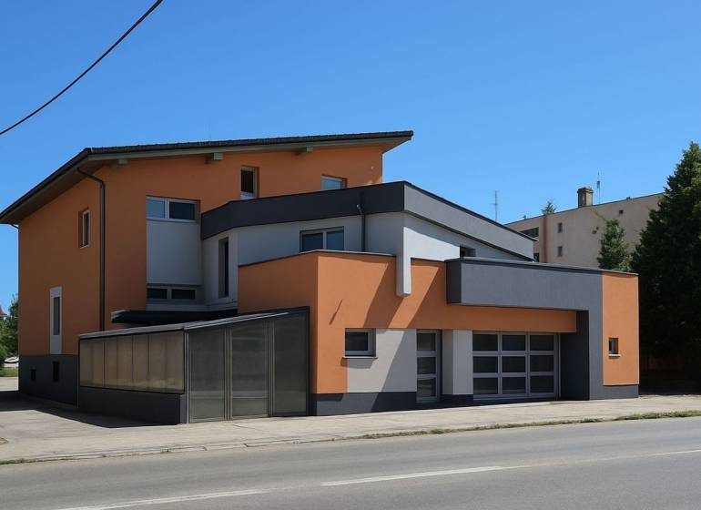 A building in Šaľa with a modern design, an orange-gray facade, and large windows.