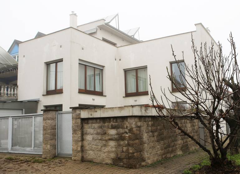Family house on Súľovská Street, Bratislava - Ružinov with a driveway and a brick fence.