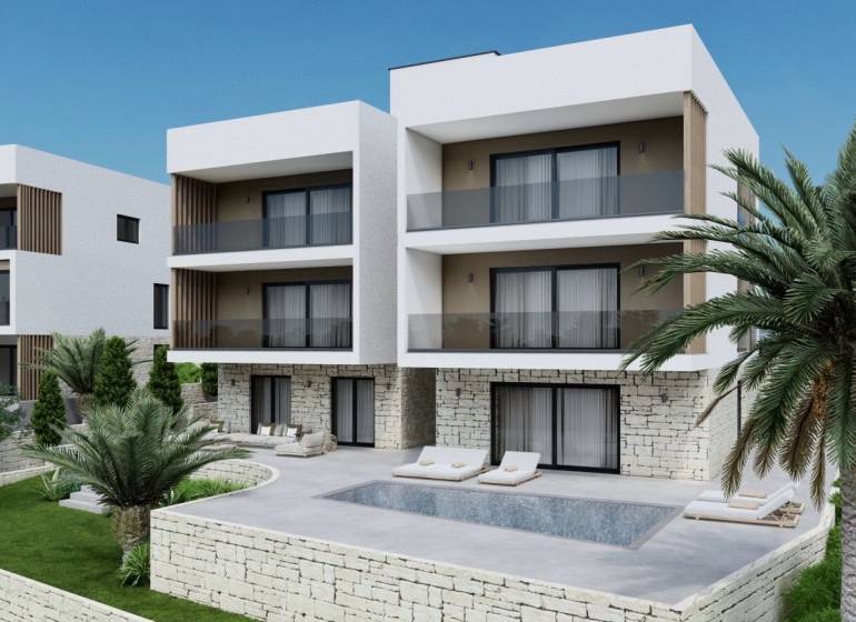 Recreational apartment in Ciovo with palm trees, a pool, and a stone terrace.