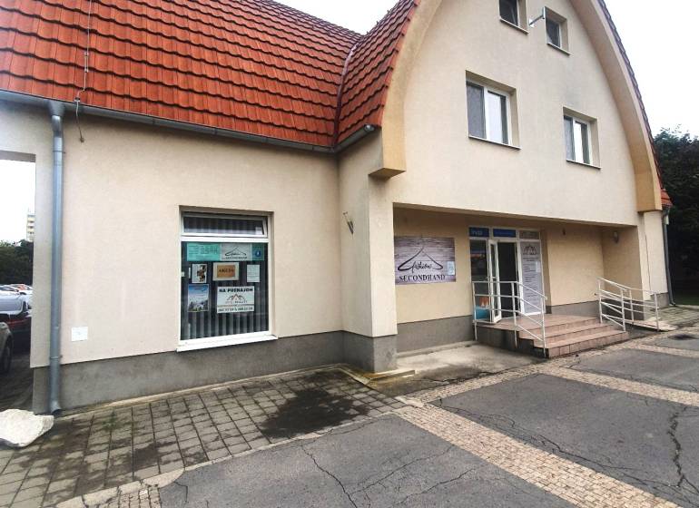 The building on Children's Square in Galanta with a red arched roof and an entrance ramp.