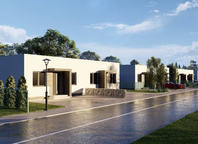 A family house on Veľké Janíkovce Street in Nitra with a garden and a driveway.