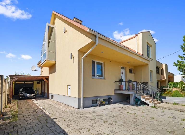 A family house on Tehelná Street in Sereď with a shelter and a garden.