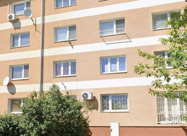 A building in Komárno with two floors, suitable for living in a 2-room apartment.