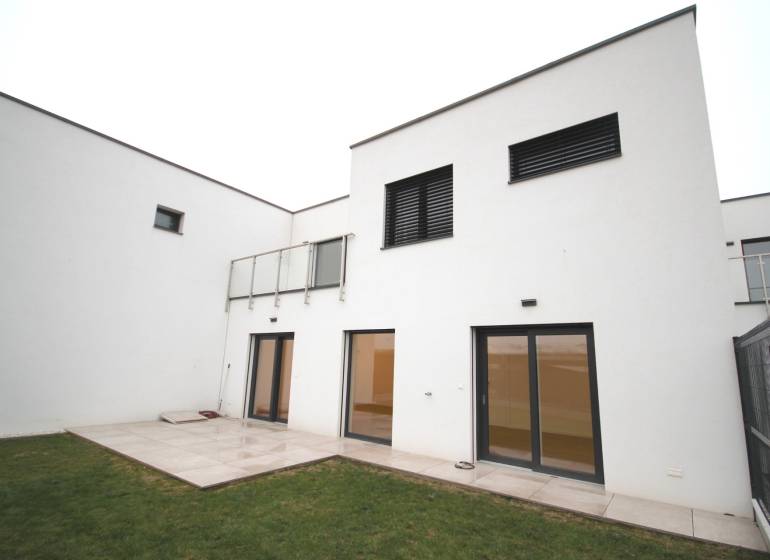 A family house on Legionárska in Trenčín with a terrace and a grassy garden.