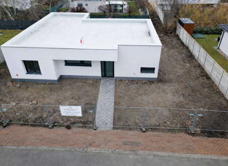 A family house on Sokolia Street in Chorvátsky Grob, surrounded by a garden and a fence.