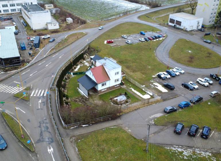 Family house on SNP Street in Považská Bystrica with an adjacent parking lot.