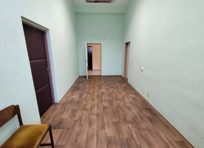 Offices with wood-patterned flooring, green walls, Nové Zámky.