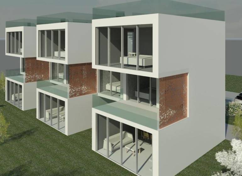 A villa on the island of Čiovo offers glass facades and a green surrounding environment.