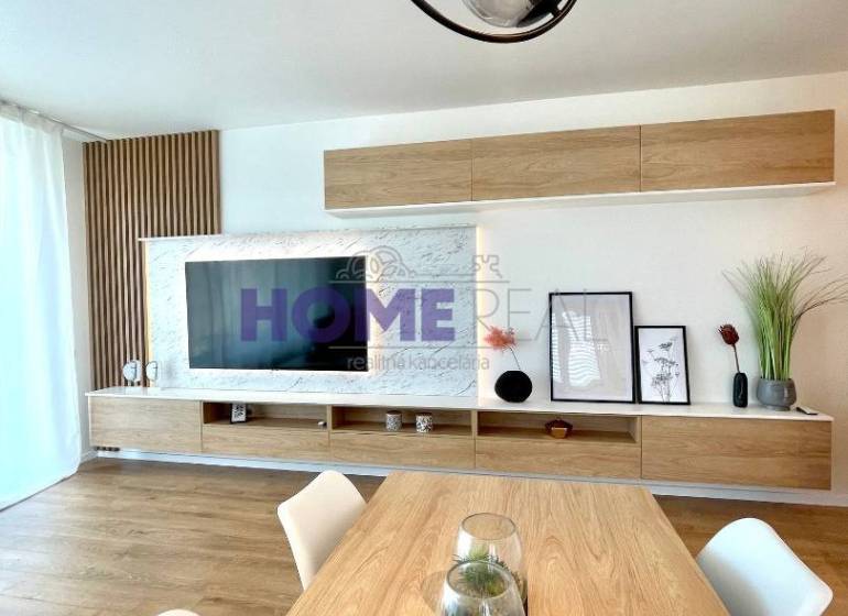 A bright living room in a 3-room apartment with a wooden decor floor and modern linear lighting.