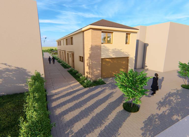 A two-story building with a road on Litoměřická Street in Topoľčianky, surrounded by trees.