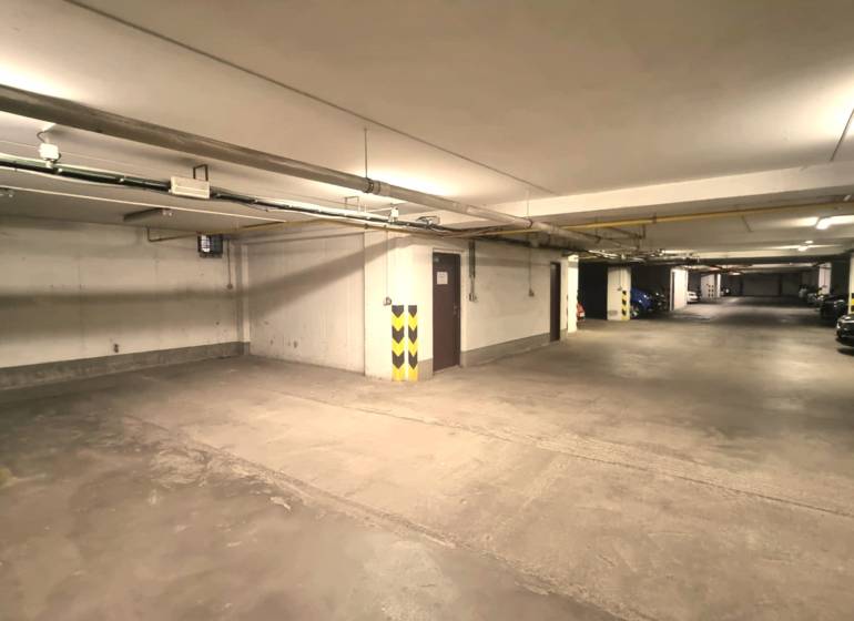 Parking garages with concrete flooring and lighting, Malacky, Malé námestie.