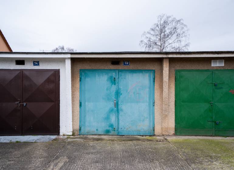 Colorful garage doors on Inovecká Street in Trenčín, various shades and textures.