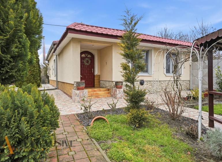 A family house in Čierny Brod surrounded by a landscaped garden with a terrace and a gazebo.