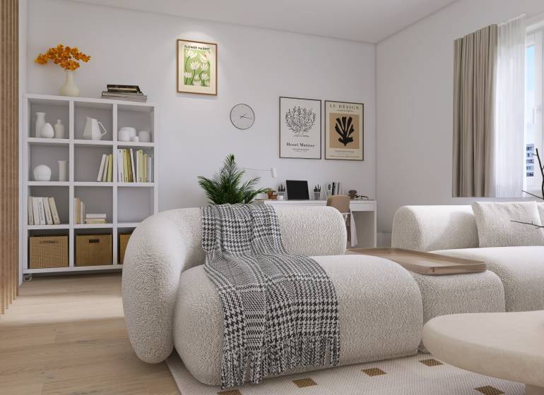 A bright living room in a three-room apartment with comfortable furniture and shelves full of books.