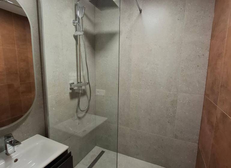 Bathroom in a 5 or more room apartment with a modern shower and sink.